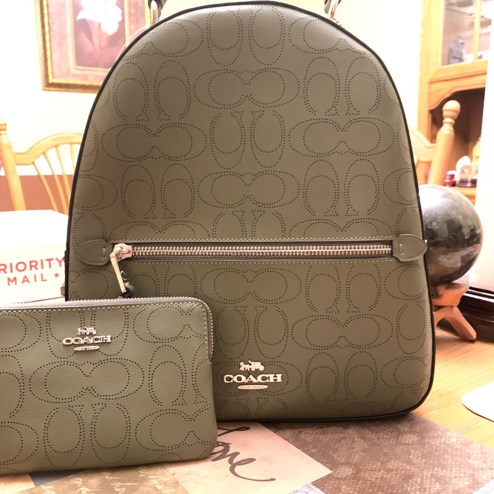 NWT olive green coach backpack with matching wristlet. Backpack is 11”x10”x4”.